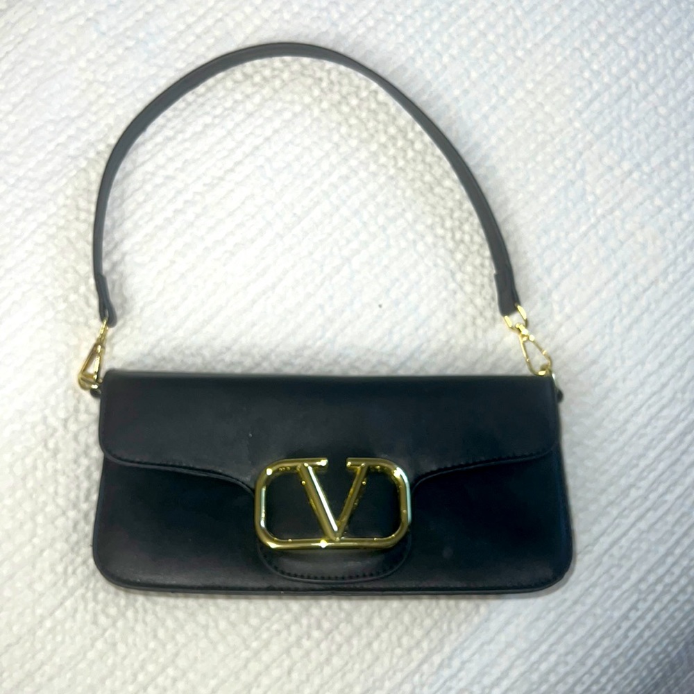 V black handbag